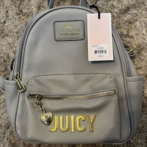 Juicy couture mini grey backpack with gold detailed 
(Never worn used)
